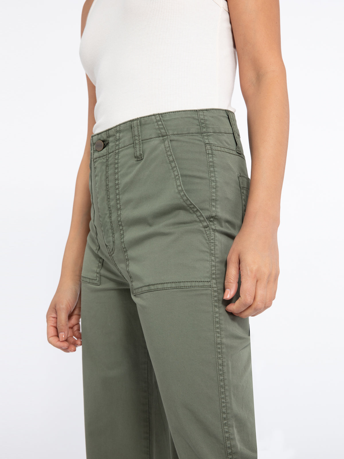 Model wearing green Vacation Crop Hiker Green pants from Sanctuary with white tank top (7351187734736)