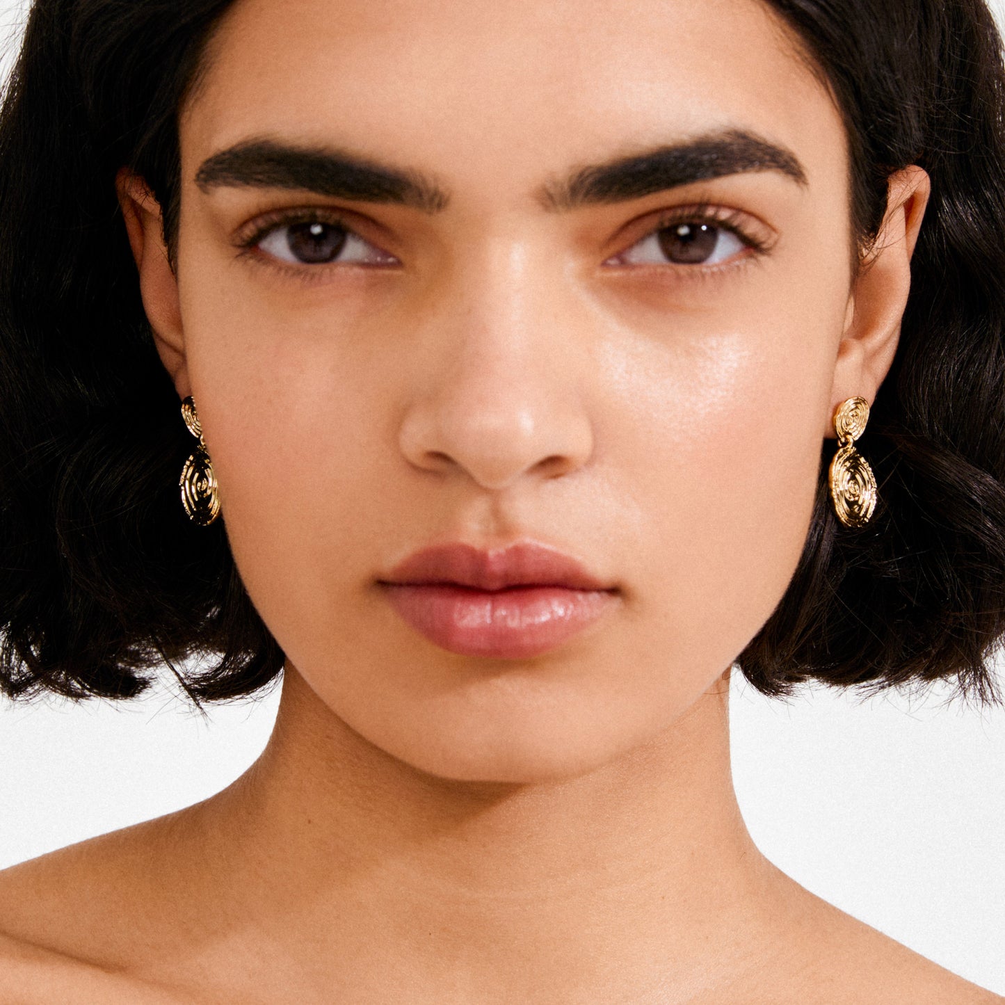 Boucles d'oreilles plaquées à l'air