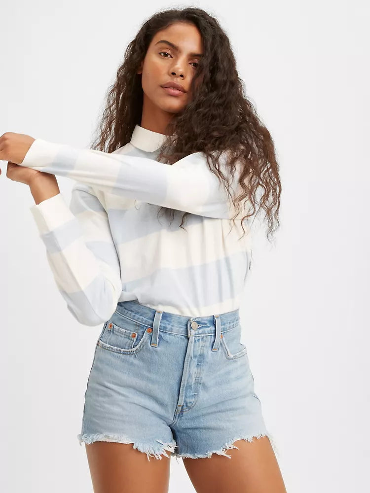 women is Levi's original high rise shorts. Light blue jean shorts feature chewed hem and vintage inspired fit.  (7721852829904)