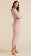 Load image into Gallery viewer, Woman wearing dusty lilac Aria Knit Midi skirt from Minkpink with Aria Knit top and brown sandals. (7714615099600)
