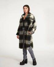 Load image into Gallery viewer, The Model wearing Steve Madden Chloe Shacket. This plaid Long shacket is perfect for cold fall days. The grey, black and dreen pattern makes it easy to wear day to day. (7809890189520)
