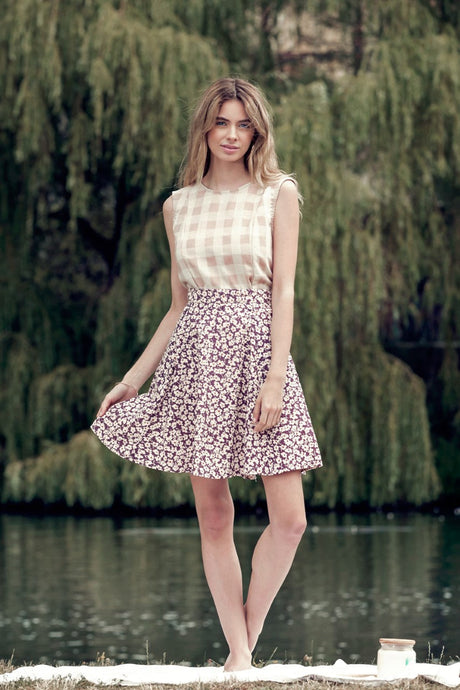 Model wearing Daisy skirt with printed daisies from Meemoza. (7724405522640)