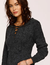 Load image into Gallery viewer, the model is wearing Heartloom Eren hoodie. The eren Hoodie features hooded sweater, with long sleeves and lace-ap detail in front. The Sweater is in a gorgeous coal color,  (7753001861328)
