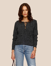 Load image into Gallery viewer, the model is wearing Heartloom Eren hoodie. The eren Hoodie features hooded sweater, with long sleeves and lace-ap detail in front. The Sweater is in a gorgeous coal color,  (7753001861328)
