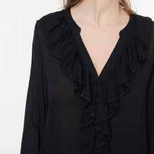 Load image into Gallery viewer, Model is wearing a black ARTLOVE SOLENE Blouse with ruffles on neck (7341140017360)
