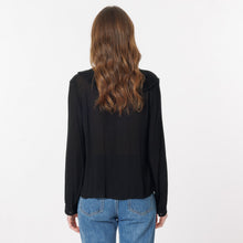 Load image into Gallery viewer, Model is wearing a black ARTLOVE SOLENE Blouse with ruffles on neck (7341140017360)
