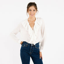 Load image into Gallery viewer, Model is wearing a white ARTLOVE SOLENE Blouse with ruffles on neck and jeans. (7341140017360)

