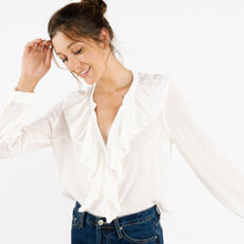 Load image into Gallery viewer, Model is wearing a white ARTLOVE SOLENE Blouse with ruffles on neck and jeans  (7341140017360)

