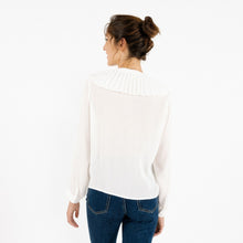 Load image into Gallery viewer, Model is wearing a white ARTLOVE SOLENE Blouse with ruffles on neck showing from the back.  (7341140017360)
