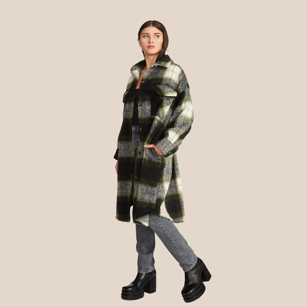 The Model wearing Steve Madden Chloe Shacket. This plaid Long shacket is perfect for cold fall days. The grey, black and dreen pattern makes it easy to wear day to day. (7809890189520)