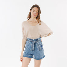 Load image into Gallery viewer, Model wearing beige Laurina Pullover with jeans shorts (7341141688528)
