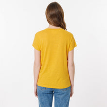 Load image into Gallery viewer, Model wearing Britney  mustard T-shirt from Artlove with jeans. (7340993151184)
