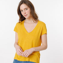 Load image into Gallery viewer, Model wearing Britney  mustard T-shirt from Artlove with jeans. (7340993151184)
